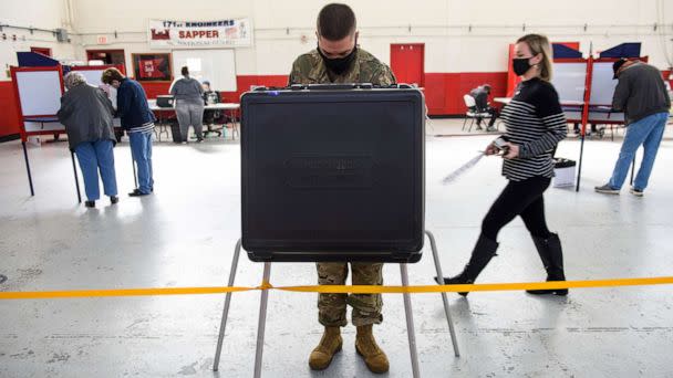 PHOTO: Mst. Sgt. Sam Wallace fills out a ballot on Election Day on Nov. 3, 2020 in St. Pauls, North Carolina. (Melissa Sue Gerrits/Getty Images, FILE)