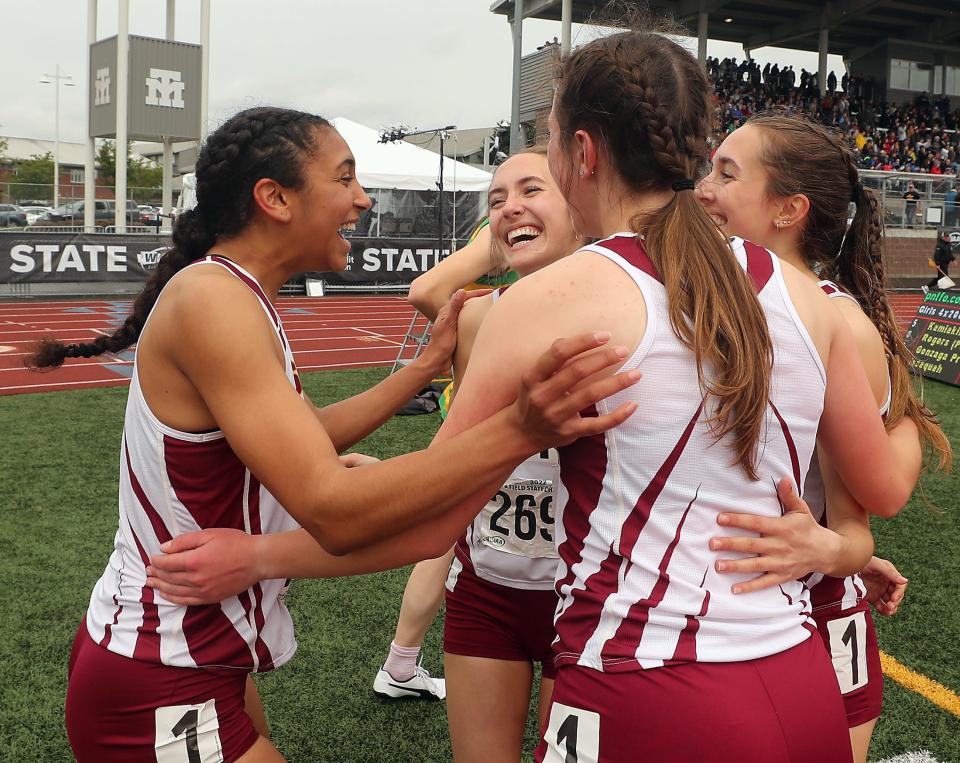 South Kitsap's 4x200 relay team members  (left to right) Marissa Crane, Ella Hopper, Savannah Kambich and Elise Hopper celebrate their first place win during the State Track and Field Championships at Mount Tahoma High School on Saturday, May 28, 2022.