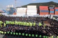 Protesters chant slogans during a rally in support of the ongoing strike by truckers at a port in Busan