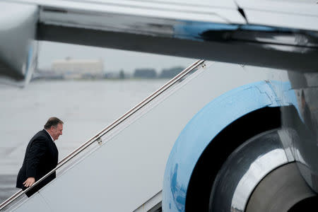 U.S. Secretary of State Mike Pompeo boards his plane at Yokota Air Force Base in Fussa, Japan, Friday, July 6, 2018, for a refueling stop on his way to Pyongyang, North Korea. Andrew Harnik/Pool via Reuters