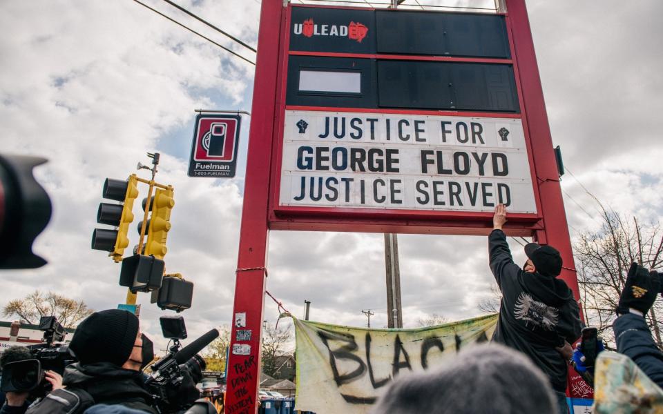 People celebrate the guilty verdict in the Dereck Chauvin trail at the intersection of 38th Street and Chicago Avenue - Brandon Bell/Getty Images