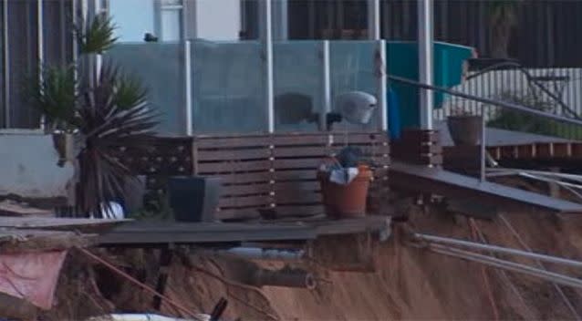 The erosion stopped right before the foundation of the housing, however residents will be bracing themselves for high tide on Monday night. Photo: 7 News