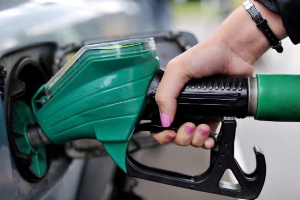 File photo dated 15/08/13 of a person using an Asda petrol pump as motorists are getting some new-year cheer, with supermarket Asda lowering its fuel prices and rivals expected to follow suit later. PRESS ASSOCIATION Photo. Issue date: Monday January 13, 2014. From tomorrow, Asda will be cutting the price of petrol and diesel by up to 2p a litre. The company said the new prices would mean motorists paying no more than 126.7p a litre for petrol and 133.7p a litre for diesel. See PA story TRANSPORT Petrol. Photo credit should read: Nick Ansell/PA Wire