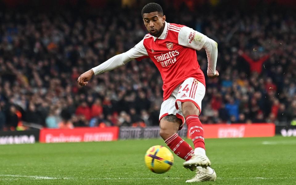 Arsenal's English midfielder Reiss Nelson shoots and scores - AFP/Glyn Kirk