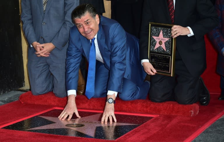 Producer and Power Rangers creator Haim Saban touches his Hollywood Walk of Fame Star at a ceremony on March 22, 2017 in Hollywood, California, where he received the 2,605th Star in the category of Television