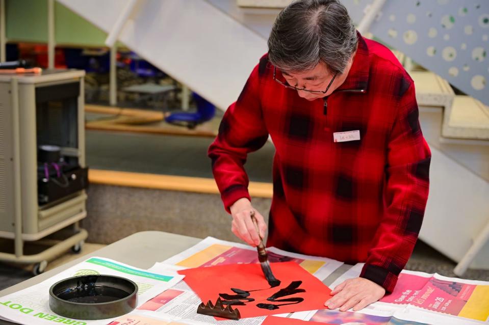 Dafang Zhang works on Chinese calligraphy as part of the Chinese Faculty and Scholar Association's celebration of Lunar New Year at Iowa State University on the evening of Jan. 21, 2023. (That was Jan. 22 in China, this year's date of Lunar New Year, which is based on the phases of the moon.) It was the association's first such celebration, though maybe not the first on campus to recognize the important holiday that's celebrated in many countries in Asia.