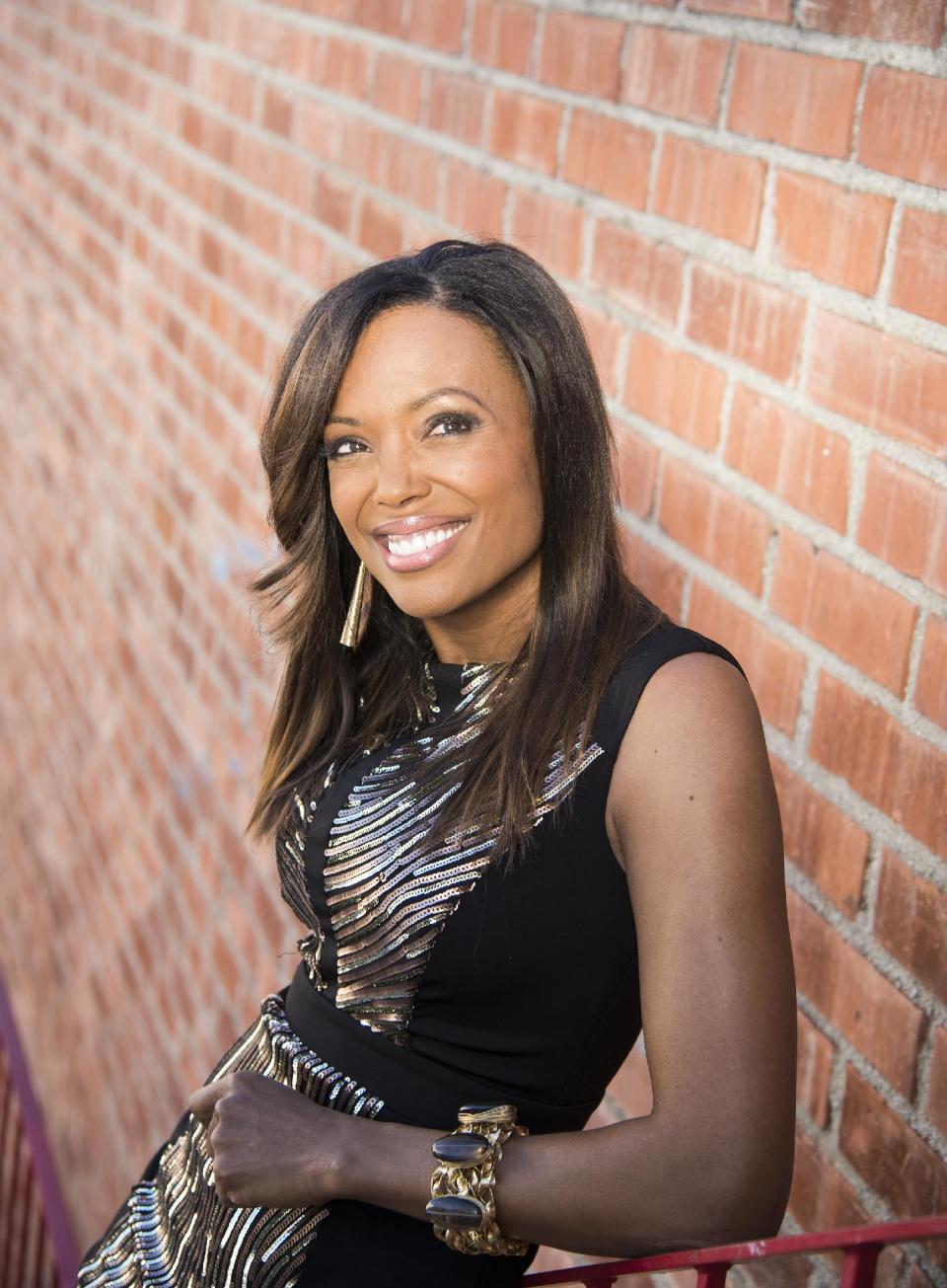 In this Friday, Dec. 20, 2013 photo, actress Aisha Tyler poses for a portrait in Los Angeles. Tyler is a regular panelist on the CBS' show, "The Talk." She is also the voice of agent Lana Kane on FX animated series, "Archer," the fifth season of which premiered this week. (Photo by Dan Steinberg/Invision/AP)