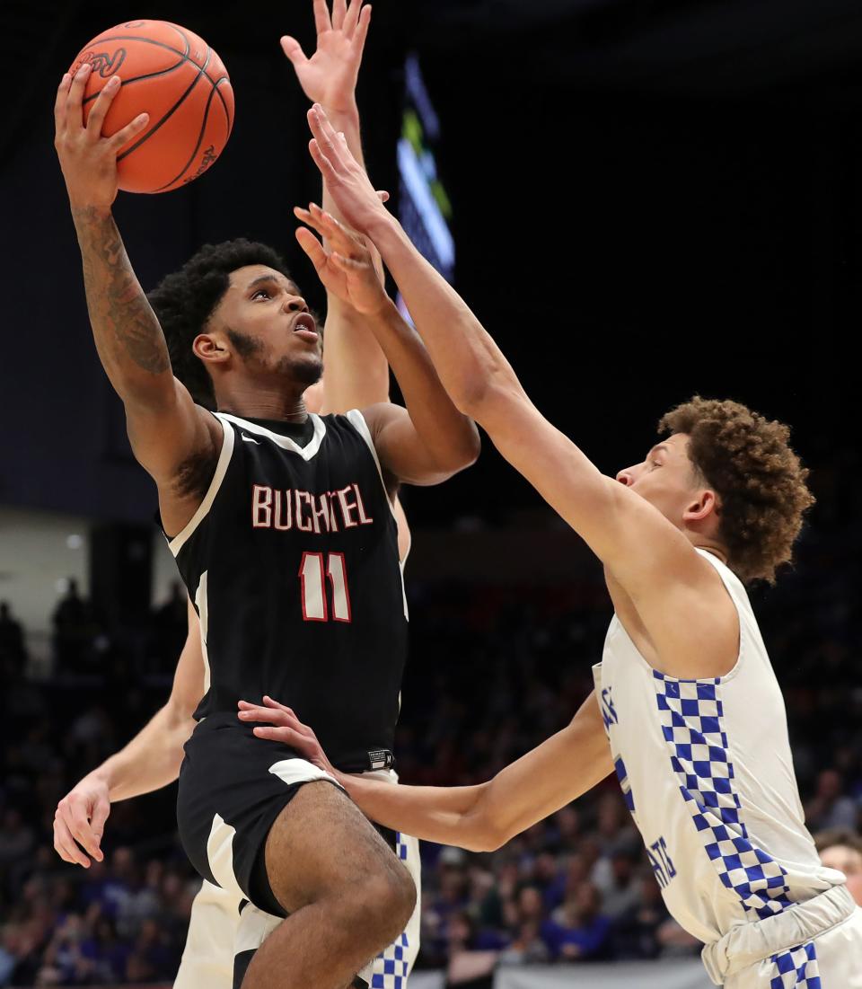 Buchtel Marcel Boyce Jr., left, looks for a layup against Bishop Ready guard Micah Germany during the second half of a Division II state semifinal, Friday, March 17, 2023, in Dayton.