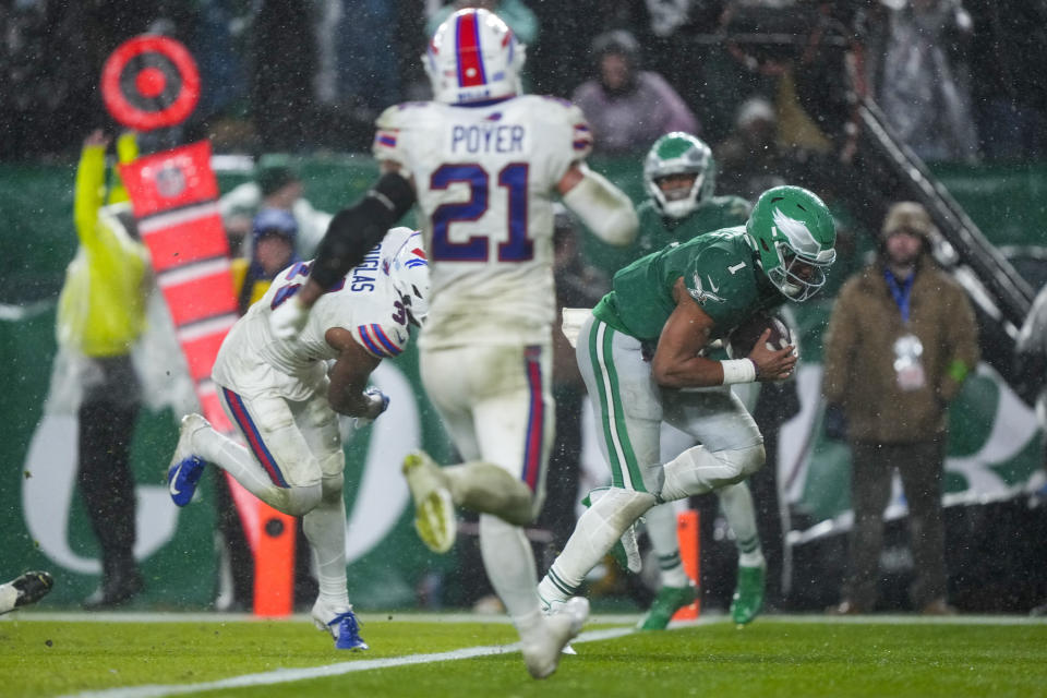 Philadelphia Eagles quarterback Jalen Hurts scores the game winning touchdown against the Buffalo Bills during overtime in an NFL football game Sunday, Nov. 26, 2023, in Philadelphia. (AP Photo/Matt Rourke)