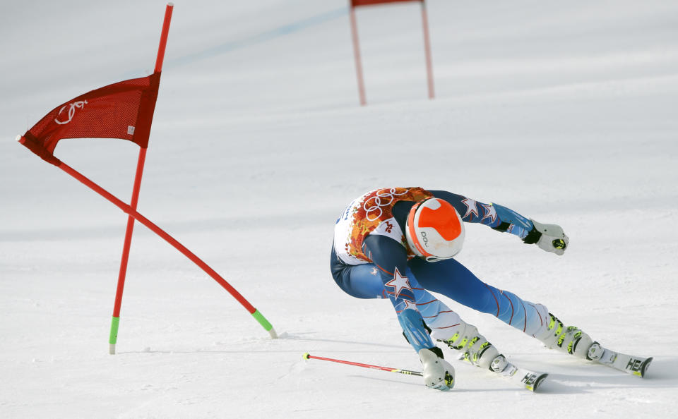United States' Bode Miller passes a gate in the first run of the men's giant slalom at the Sochi 2014 Winter Olympics, Wednesday, Feb. 19, 2014, in Krasnaya Polyana, Russia. (AP Photo/Christophe Ena)