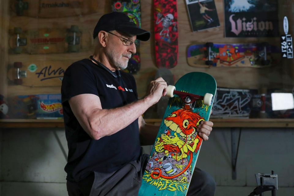 Modern Skate owner George Leichtweis has been managing skate parks around Michigan over 45 years and has seen the sport grow from skateboards to rollerblades to scooters.  Leichtweis assembles one of the decks he sells in the retail shop located in his venue on Saturday, July 13, 2023.  