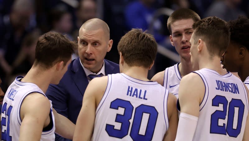 BYU’s head coach Mark Pope instructs his team during a timeout against the UCF Knights at the Marriott Center in Provo on Tuesday, Feb. 13, 2024.