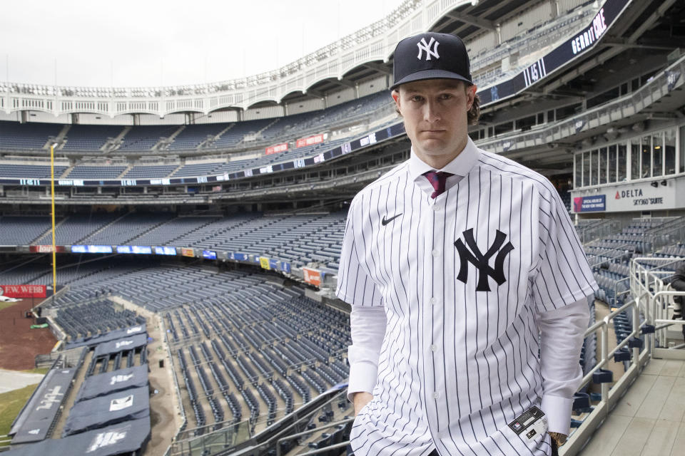 Gerrit Cole poses at Yankee Stadium as the newest New York Yankees player is introduced during a baseball media availability, Wednesday, Dec. 18, 2019 in New York. The pitcher agreed to a 9-year $324 million contract. (AP Photo/Mark Lennihan)