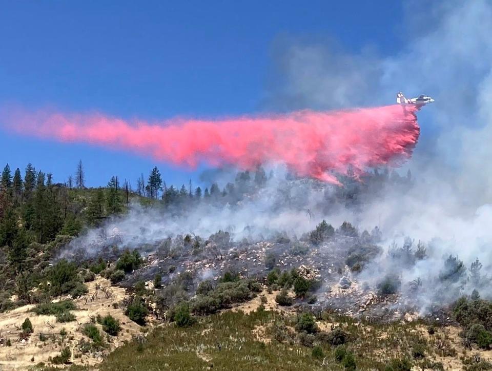 Air tanker drops retardant on a 3-acre fire off Iron Mountain Road near Keswick on Thursday, July 7, 2022.