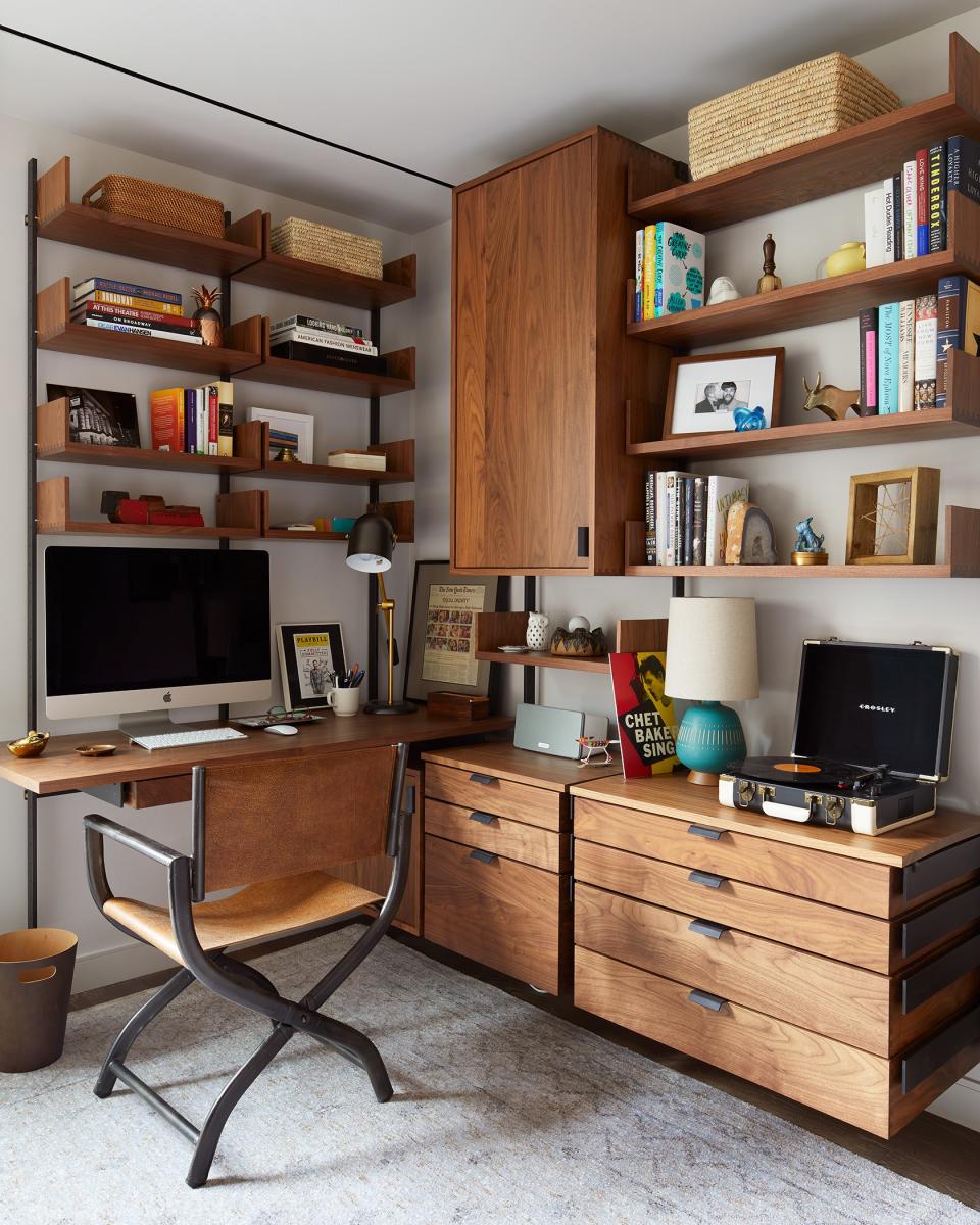 The home office is actually in a corner of the guest bedroom. “I had a very specific idea of what I wanted in that desk area,” Ferguson says. “It took a little while to find it, but once we did, it was exactly what I pictured.” The cabinetry was done by Atlas, the chair is from RH, and the rug is ABC Carpet & Home.