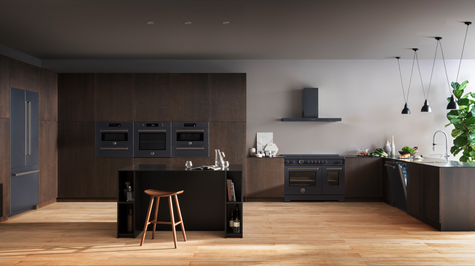 a kitchen with black cabinets