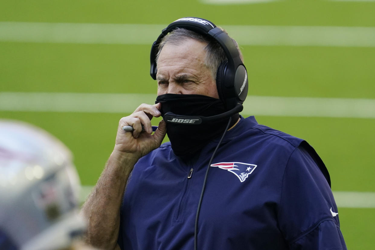 New England Patriots head coach Bill Belichick wears a face mask on the sidelines during the first half of an NFL football game against the Houston Texans, Sunday, Nov. 22, 2020, in Houston. (AP Photo/David J. Phillip)