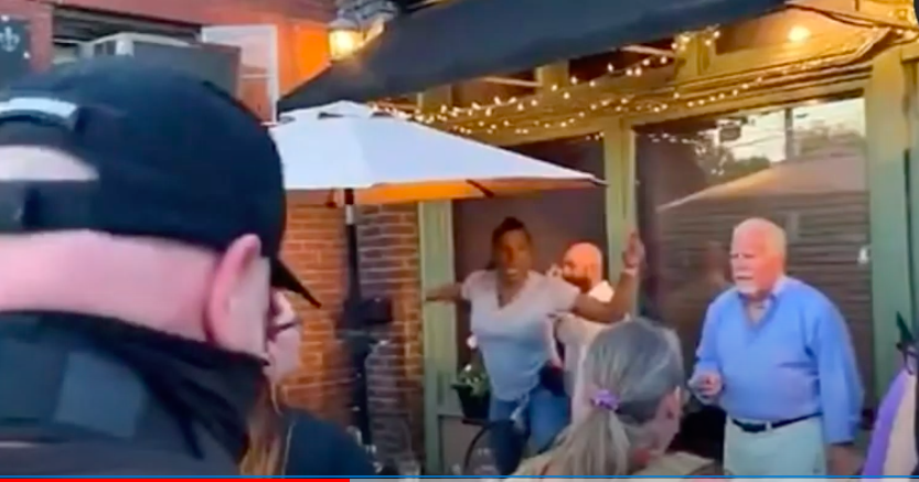 <p>Diner in Louisville wields a handgun at BLM protesters. Screengrab</p> (World news YouTube)