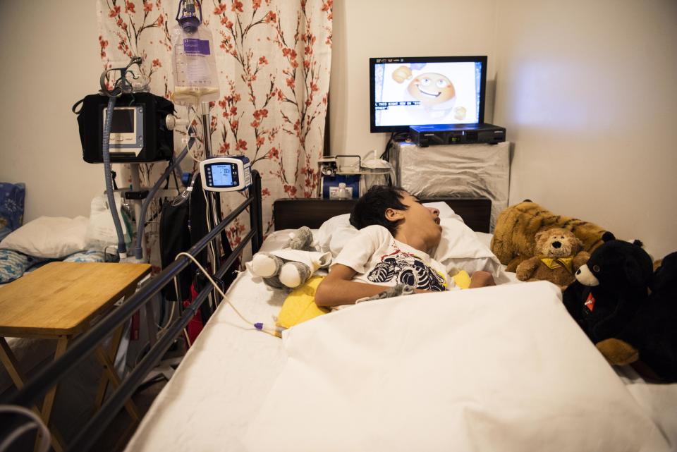 Noori's son Ahmad, 14, has spina&nbsp;bifida and needs 24-hour care. (Photo: Damon Dahlen/HuffPost)