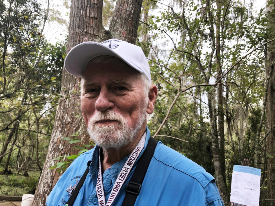 Bob Thomas is photographed during Science Day at the Jean Lafitte National Historical Park and Preserve’s Barataria Unit on Saturday, Oct. 20, 2018 in Marrero, La. Thomas was honored by having one of three newly identified species of snakes from the Galapagos Islands named after him. He is an environmental biologist and head of the Center for Environmental Communication at Loyola University New Orleans. He says he has a picture of the snake on his wall and it makes him smile every time he looks at it. It's called Pseudalsophis thomasi. (AP Photo/Janet McConnaughey)