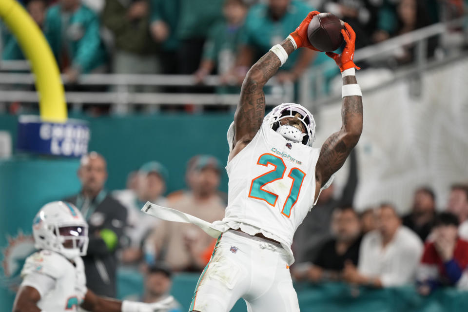 Miami Dolphins safety DeShon Elliott (21) intercepts a pass in the end zone during the first half of an NFL football game against the Buffalo Bills, Sunday, Jan. 7, 2024, in Miami Gardens, Fla. (AP Photo/Wilfredo Lee)