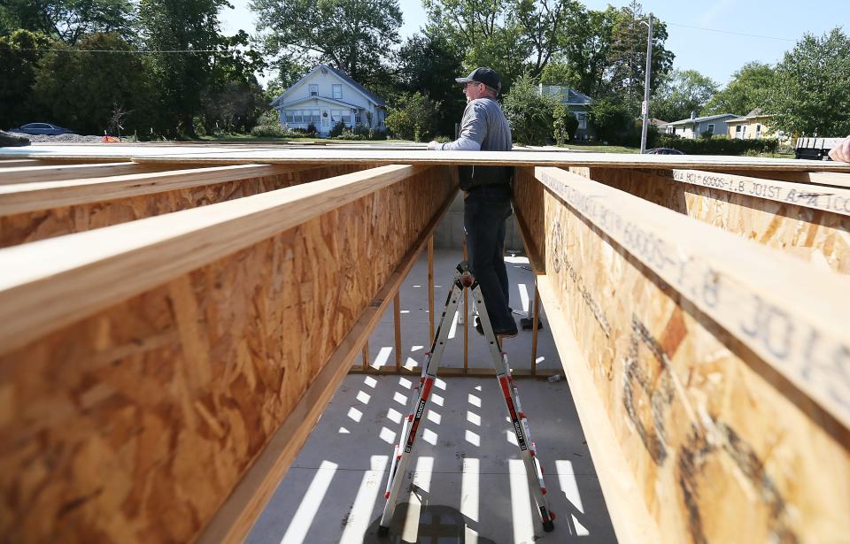 First Interstate Bank employee David Tucker works to build a Habitat for Humanity home along Wilmoth Street Wednesday, Sept. 13, 2023, in Ames.