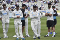 New Zealand players wait during the presentation ceremony after their win in the second cricket test match against England at Edgbaston in Birmingham, England, Sunday, June 13, 2021. New Zealand won the series 1-0. (AP Photo/Rui Vieira)