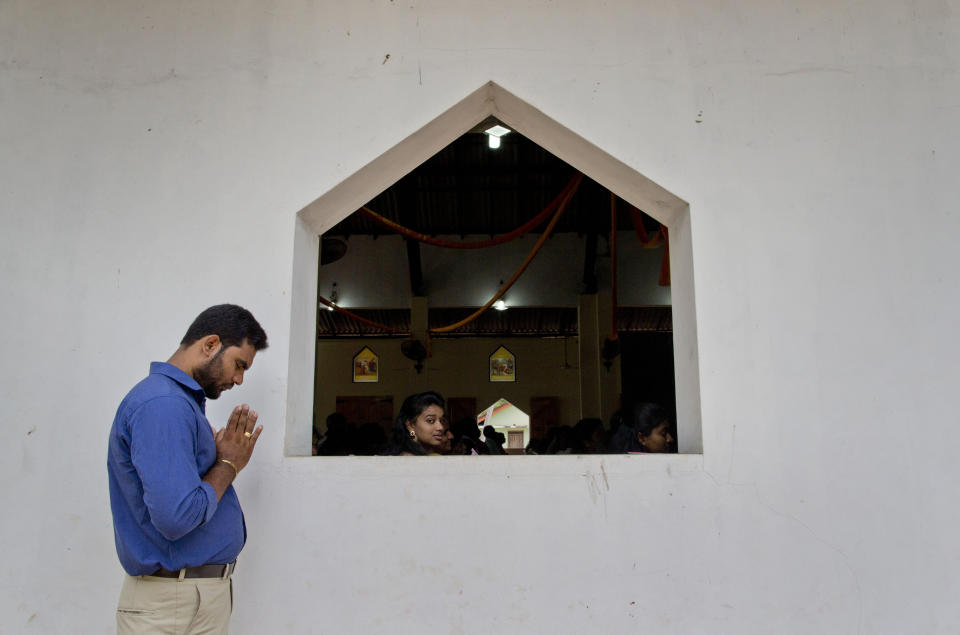 Catholics participate in a Mass at St. Joseph's church in Thannamunai, Sri Lanka, Tuesday, April 30, 2019. This small village in eastern Sri Lanka has held likely the first Mass since Catholic leaders closed all their churches for fear of more attacks after the Easter suicide bombings that killed over 250 people. (AP Photo/Gemunu Amarasinghe)