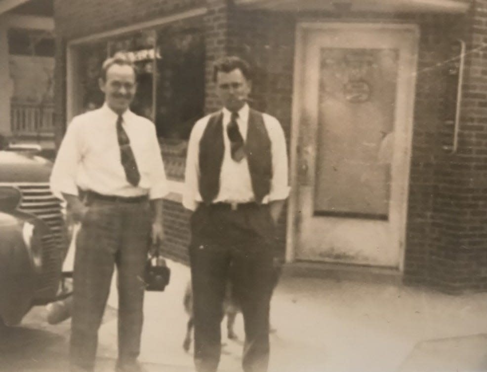This is a photo of Micka Meats founder Charlie Micka (right) and Ernie Becker (architect) in front of Micka’s Market, 199 Cole Rd., Monroe, circa 1946.  They were planning a building expansion project.  Vallie Dussia loaned Charlie Micka money for the project.  Micka Meats operated in Monroe for many years starting in 1937. The location was purchased by Danny Vuich, Jr. and then became known as Danny's II in 1983.