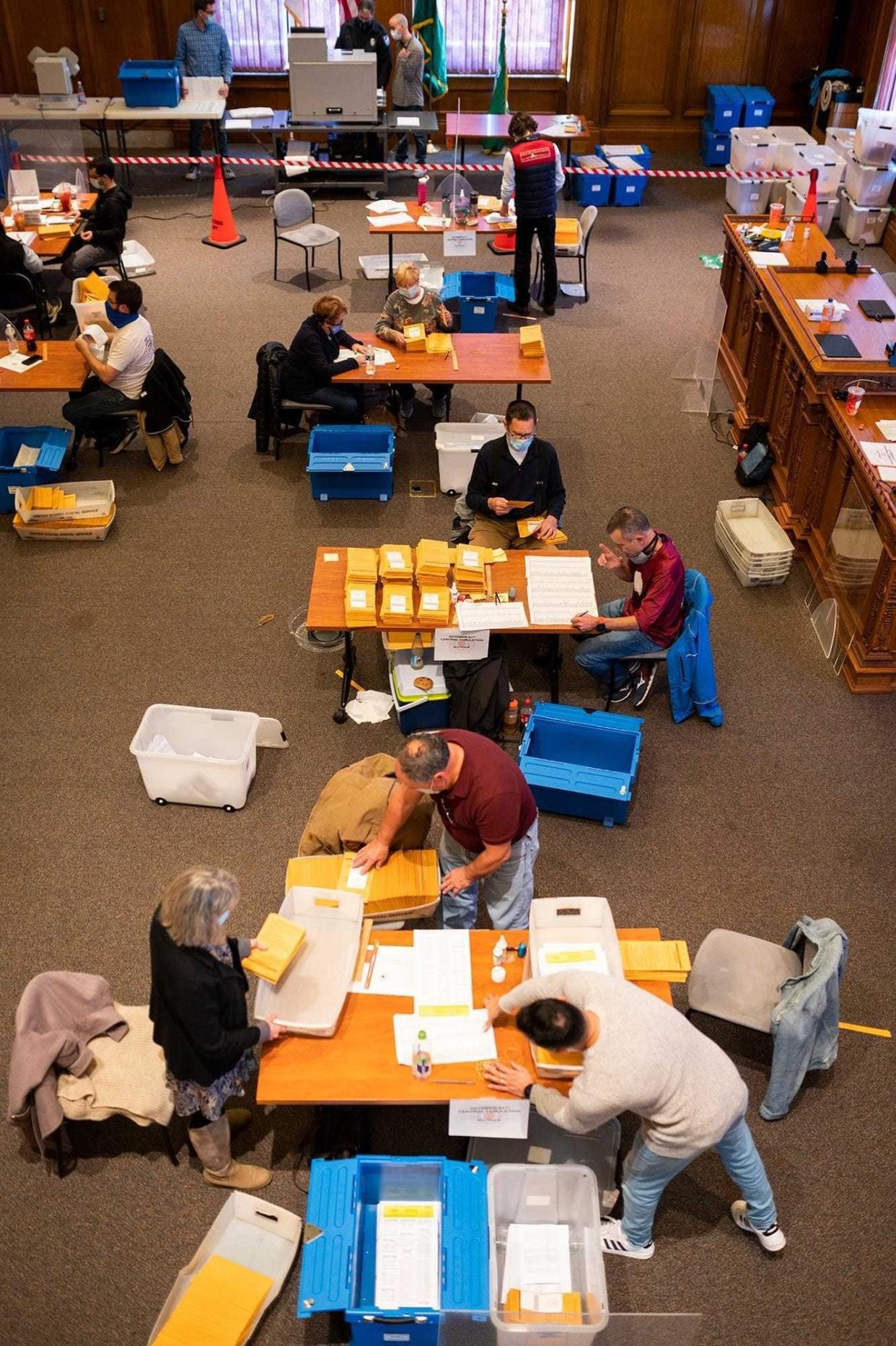 Volunteers and city employees count ballots Nov. 8, 2020, at Worcester City Hall.