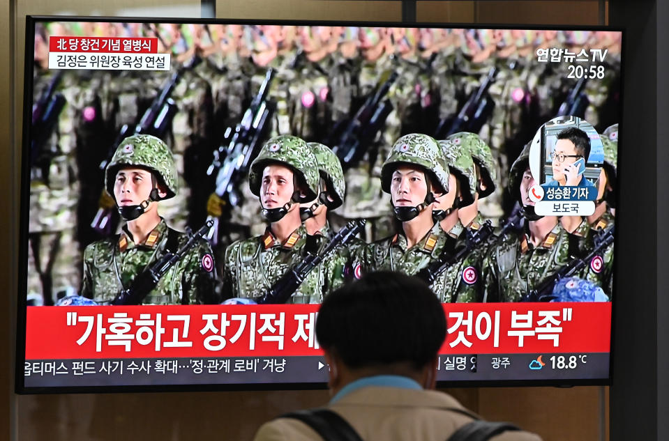 A man watches a television news broadcast of a military parade commemorating the 75th anniversary of North Korea's ruling Workers' Party held in Pyongyang, at a railway station in Seoul on October 10, 2020. - Nuclear-armed North Korea held a giant military parade on October 10, television images showed, with thousands of maskless troops defying the coronavirus threat and Pyongyang expected to put on show its latest and most advanced weapons. (Photo by Jung Yeon-je / AFP) (Photo by JUNG YEON-JE/AFP via Getty Images)