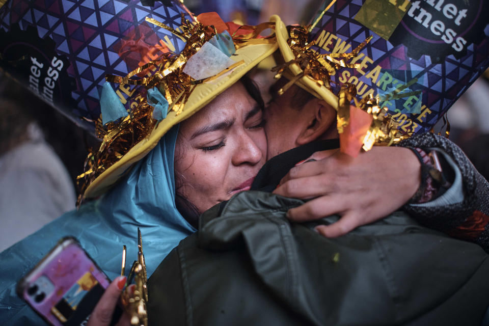 Revellers kiss and hug during the New Year's Eve celebrations in Times Square on Sunday, Jan. 1, 2023, in New York. (AP Photo/Andres Kudacki)