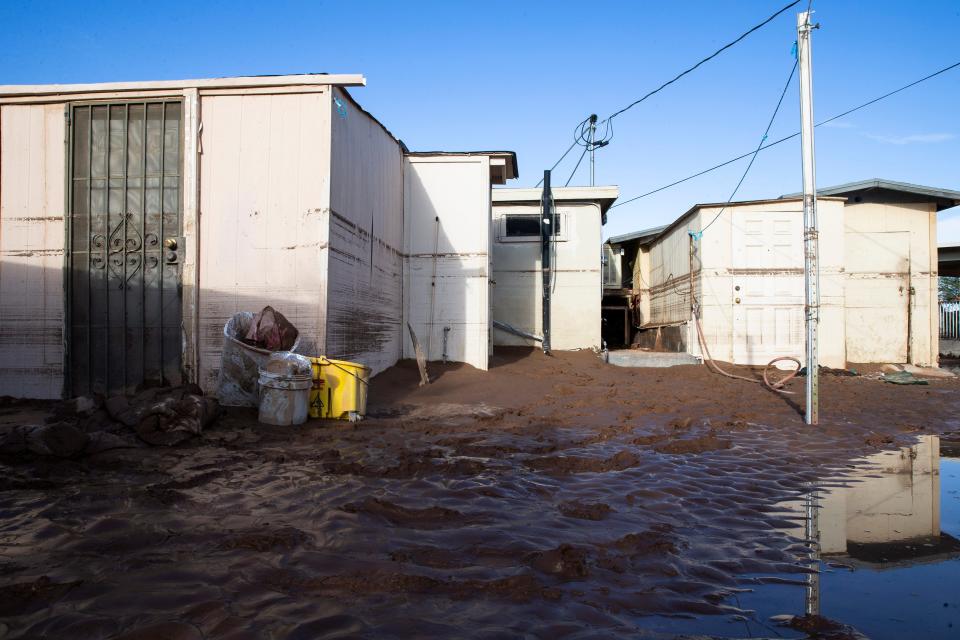 Residents were evacuated out of this flooded area after a heavy monsoon rain last night, flood lines are visible on the homes and residents were forced to sit on the roofs in Gila Bend, Aug. 14, 2021.