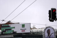 A huge poster advertising a Russian state propaganda outlet that recently launched in Serbia is seen at the shopping center in Belgrade, Serbia, Saturday, Jan. 21, 2023. A friendly, fellow-Slavic nation, Serbia has welcomed the fleeing Russians who need visas to travel to much richer Western European states. But in Serbia, they have not escaped the long reach of Putin's hardline regime influence.(AP Photo/Darko Vojinovic)