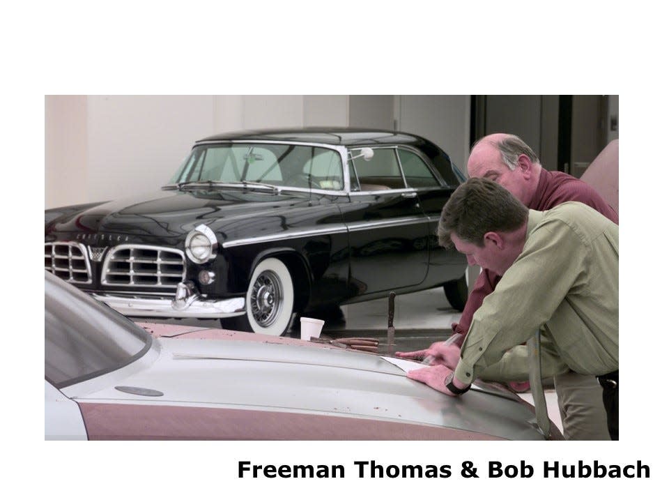 Chrysler designer Bob Hubbach, front, and then-director of advanced design Freeman Thomas working with a 1950s Chrysler 300 in the background.