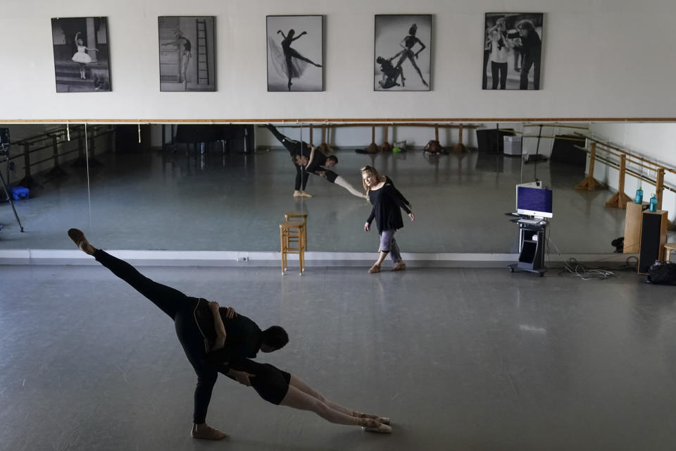 Adrian Blake Mitchell, left, and Andrea Laššáková rehearse with Francine Kessler Lavac, right, on Monday, April 18, 2022, in Santa Monica, Calif. Mitchell and Laššáková left their positions at the Mikhailovsky Ballet Theatre in St. Petersburg and fled Russia ahead of the invasion of Ukraine. (AP Photo/Ashley Landis)