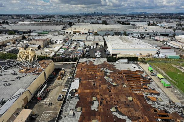 PHOTO: An aerial image shows damage to the roof of a paper box company building from a tornado during a winter storm in Montebello, a city in Los Angeles County, Calif., on March 23, 2023. (Patrick T. Fallon/AFP via Getty Images)