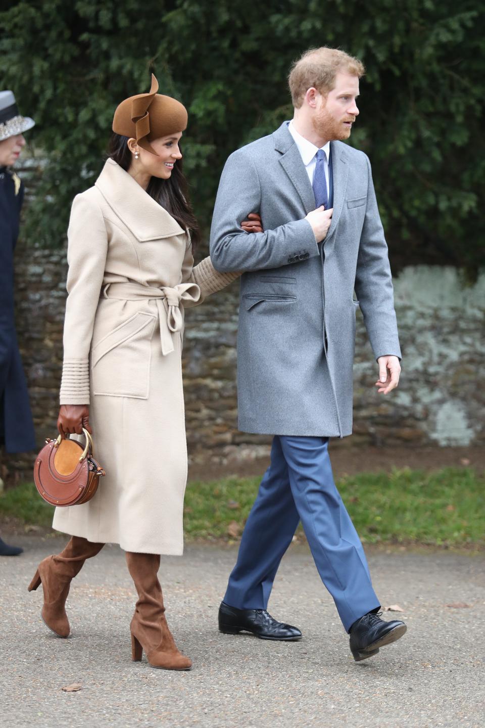 Meghan Markle and Prince Harry walk arm in arm on Christmas in 2017.