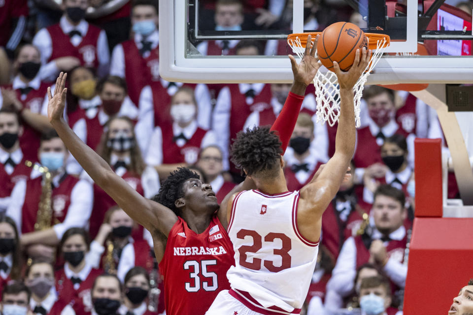 Nebraska center Eduardo Andre (35) attempts to block a shot by Indiana forward Trayce Jackson-Davis (23) during the first half of a NCAA college basketball game, Saturday, Dec. 4, 2021, in Bloomington, Ind. (AP Photo/Doug McSchooler)