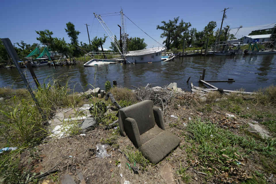 Damage from Hurricane Ida, which tore through the bayou communities in August 2021, sits along Bayou Pointe-au-Chien, La., Thursday, May 26, 2022. (AP Photo/Gerald Herbert)