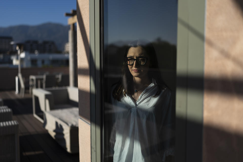 Leili Ghazi, a 22-year-old immigrant from Iran, stands for a photo in Pasadena, Calif., Tuesday, June 21, 2022. Two years ago, Leili Ghazi quit studying biomedical engineering in Iran and seized the chance to travel to the United States to build a new life for herself and her parents. Now, the 22-year-old is separated indefinitely from her family because her father performed military service more than two decades ago for a branch of the Iranian armed forces that the U.S. government has declared a foreign terrorist organization. (AP Photo/Jae C. Hong)