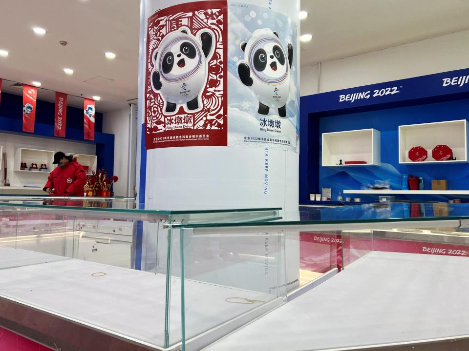 Empty shelves are seen during operating hours at a flagship merchandise store for the Beijing 2022 Winter Olympics, following a surge in demand for merchandise featuring the official mascot Bing Dwen Dwen, in Beijing, China February 8, 2022. Picture taken February 8, 2022.
