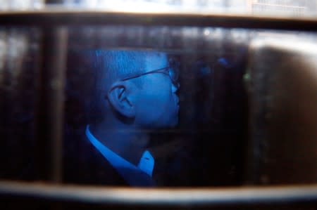 Activist Leung leaves the High Court in a prison van as he appeals against conviction and sentence, in Hong Kong