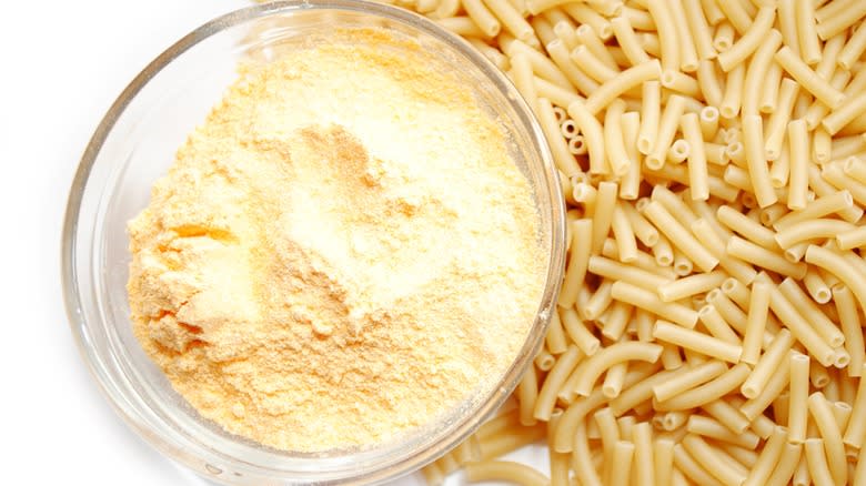 Powdered cheese and raw pasta