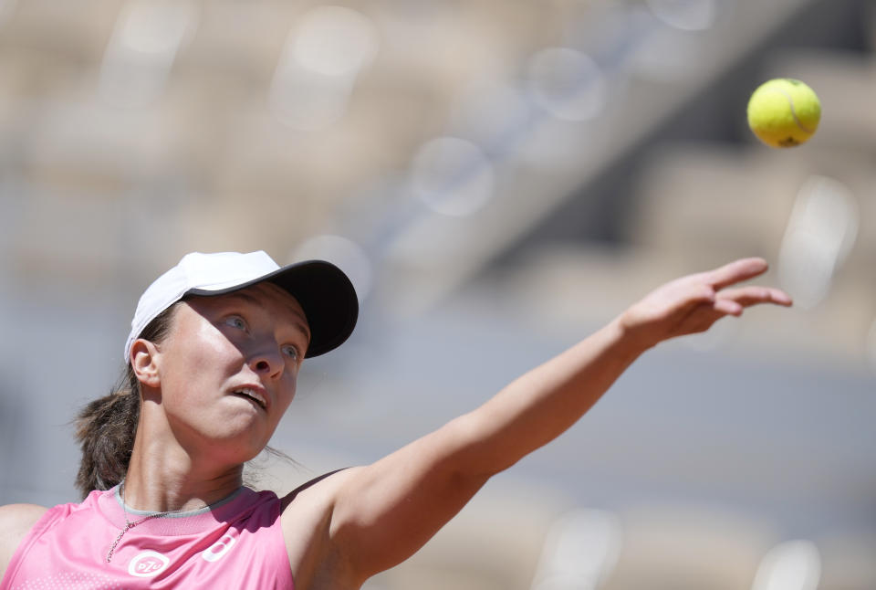 Poland's Iga Swiatek serves to Slovenia's Kaja Juvan during their first round match on day two of the French Open tennis tournament at Roland Garros in Paris, France, Monday, May 31, 2021. (AP Photo/Thibault Camus)