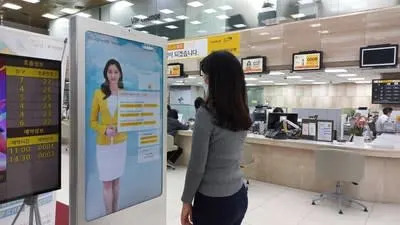 Image of an AI Banker in a Kiosk installed in KB Kookmin Bank Donam-dong Branch. (PRNewsfoto/DeepBrain AI)