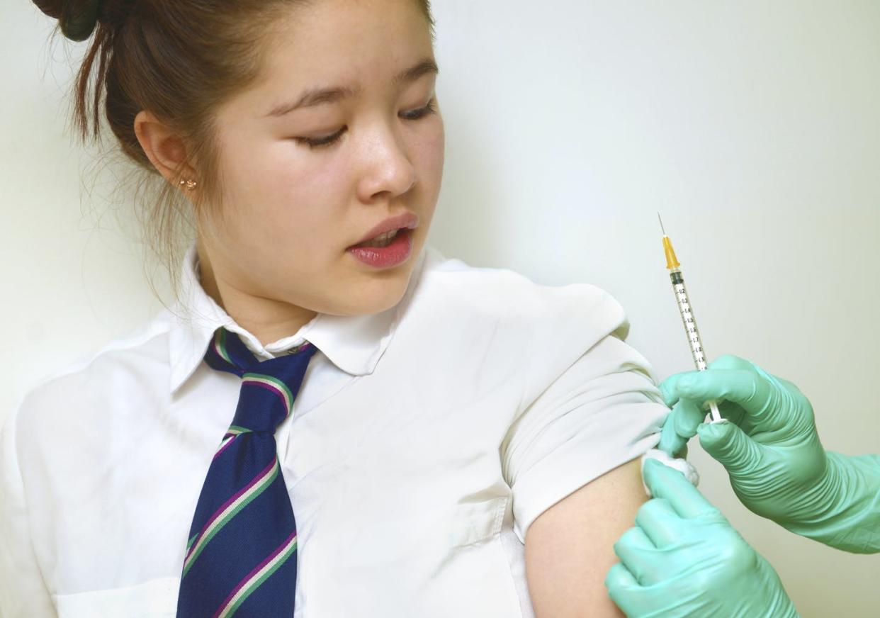 <span class="caption">Rates of HPV screenings and vaccinations remain low for some subgroups of Asian American women.</span> <span class="attribution"><a class="link " href="https://www.gettyimages.com/detail/photo/schoolgirl-getting-vaccinated-royalty-free-image/871552754?adppopup=true" rel="nofollow noopener" target="_blank" data-ylk="slk:Getty Images / Peter Dazeley;elm:context_link;itc:0;sec:content-canvas">Getty Images / Peter Dazeley</a></span>