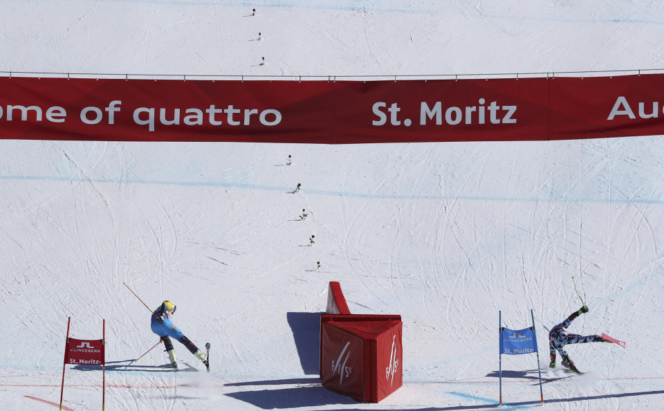 Sweden's Andre Myhrer, left, and Austria's Marcel Hirscher compete in a parallel race during a team event, at the alpine ski World Championships, in St. Moritz, Switzerland, Tuesday, Feb. 14, 2017. (AP Photo/Alessandro Trovati)