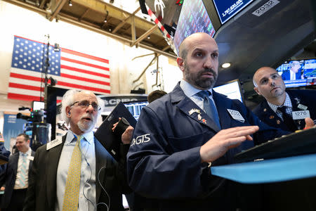 Traders work on the floor at the New York Stock Exchange (NYSE) in New York, U.S., April 24, 2019. REUTERS/Brendan McDermid
