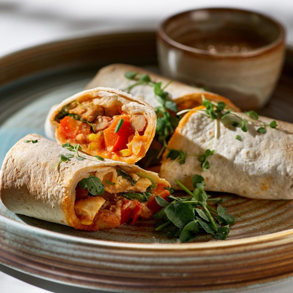 Healthy vegan salad tortilla wraps with tofu and vegetables. Love for a healthy raw food concept.